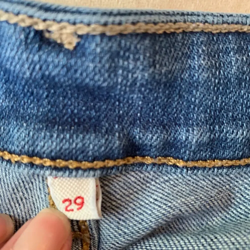 Levis rolled hem distressed jean shorts 29
